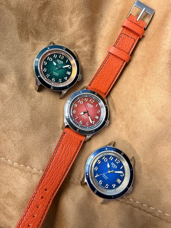 Three SENA watches with colorful straps